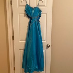 Belk’s Prom dress . Size 4 . Two side cuts outs with beaded spaghetti straps.